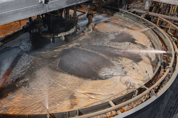 Flotation and processing for copper ore. Closeup of fine pulp with bubbles, concentration plant