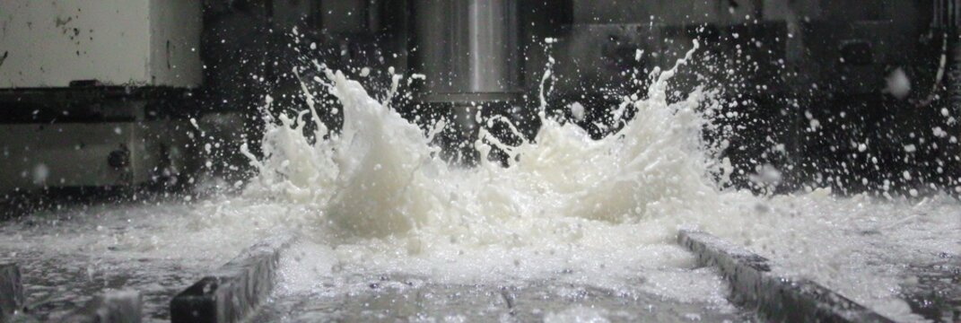 Water Splashes From Machinery in a High-Tech Production Environment During a Dynamic Manufacturing Process