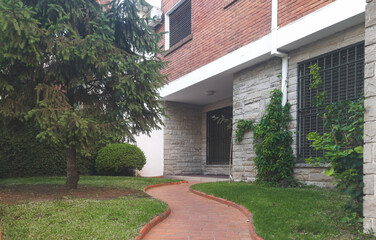 A modern house with a green garden in Buenos Aires