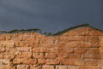 a fragment of a destroyed wall where brickwork is visible.  Copy space 