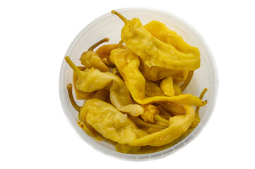 Canned chili peppers in plastic container on white background