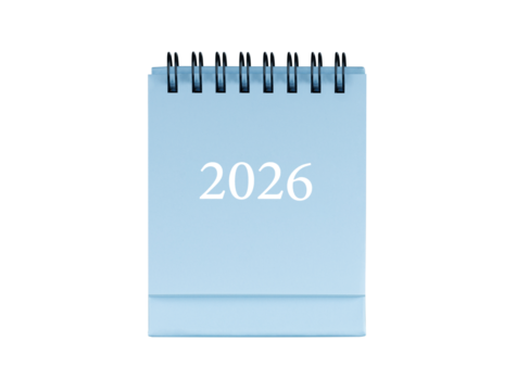 Desktop calendar for cover 2026 in blue colour. Mini planner for business and finance, spiral view on isolated white background close up.