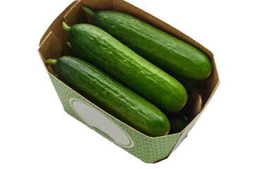 Mini cucumbers in cardboard box on white background