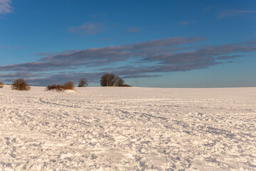 Wide Snow-Covered Field under Blue Sky, Rh&ouml;n Mountains, Germany