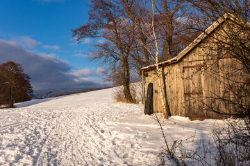 Rustic Wooden Hut in Snowy Winter Landscape, Rh&ouml;n Mountains, Germany