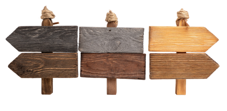 Three weathered wooden directional signs