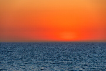 Soft afterglow over the Atlantic Ocean after sunset with gentle waves, Portugal, Ovar – Furadouro, 9 October 2025