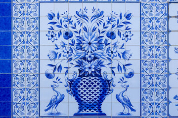 Large azulejo mural featuring floral vase motif and ornamental blue tile borders, Portugal, Válega, 9 October 2025