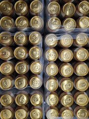 Beer cans. Aluminum beer cans in supermarket. Beer products on shop shelves