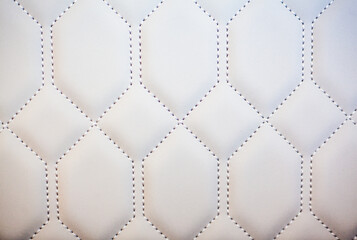 white leather car seat texture with stitched geometric pattern
