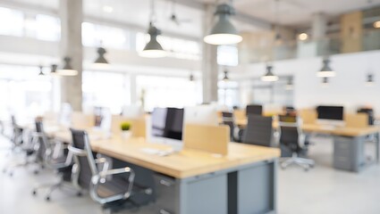 Blurred image of a modern bright open concept office space environment