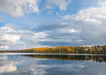 Lake with a cloudy sky in the background