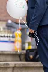 A man with a briefcase and a balloon