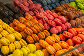 Colorful French Macarons Display in Bakery Shop Window - Vibrant Dessert Pastry Assortment