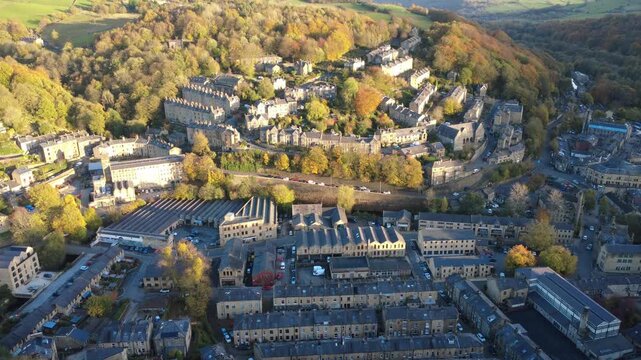 high aerial view of the town of hebden bridge in autumn showing the calder valley with mytholmroyd in the distance