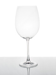Empty Wine Glass on glass table isolated
