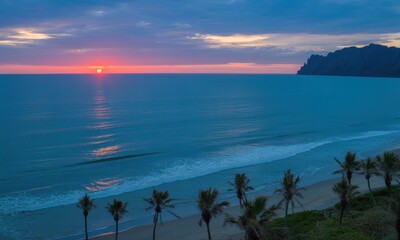 Sunrise over tranquil ocean beach