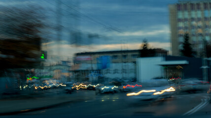 Obraz premium Abstract cityscape with blurred lights and buildings at dusk