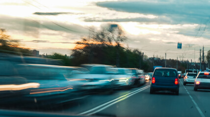 Blurred motion of cars on a highway at sunset, capturing the essence of travel