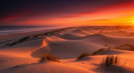 Stunning golden hour sunset paints vibrant hues across rolling desert dunes and serene ocean coastline