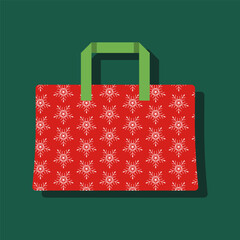 A red and green bag with snowflakes on it