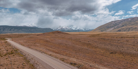 Patagonia Landscape Panorama showing grasslands and snow covered peaks