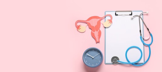 Clipboard with stethoscope, paper uterus and clock on pink background with space for text