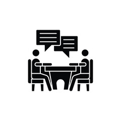 Black silhouette icon of two people sitting at a table with speech bubbles, representing a business meeting or interview.