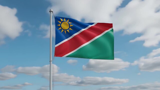 Namibia's vibrant flag waving proudly against a sunny blue sky with fluffy clouds in a dynamic patriotic display