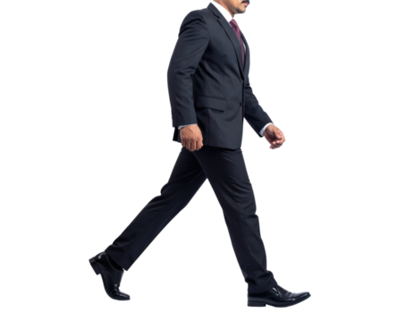 Confident businessman in a dark suit walking with purpose 1.