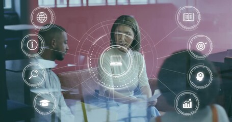 Woman presenting papers and leading business meeting, activating HUD with laptop icon pulsing - Powered by Adobe