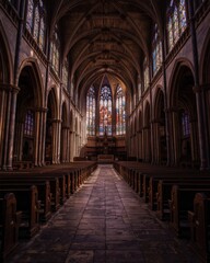 Obraz premium Stunning interior view of a gothic cathedral showcasing architecture and stained glass windows