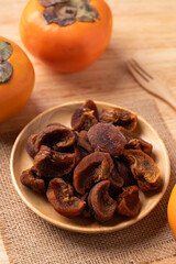 Dried persimmon on wooden plate ready to eating, Sweet and chewy