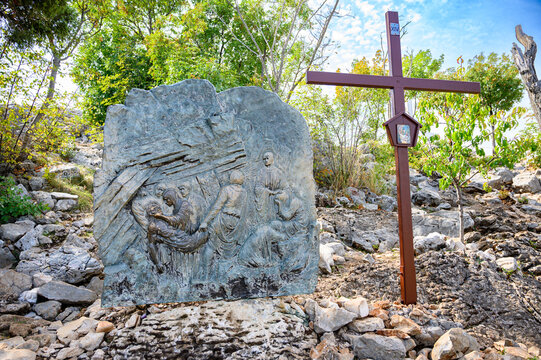 Station XIV: Jesus is laid in the tomb. The Way of the Cross on Mount Križevac (the Cross Mountain) in Medjugorje.