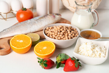 Different products on white table, closeup. Food Allergy Awareness Month