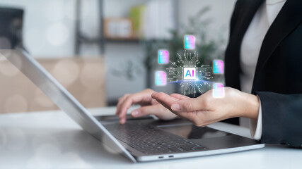 Businesswoman using a laptop with a virtual AI processor chip, managing digital document icons. Concept of artificial intelligence for data analysis, automated file management,