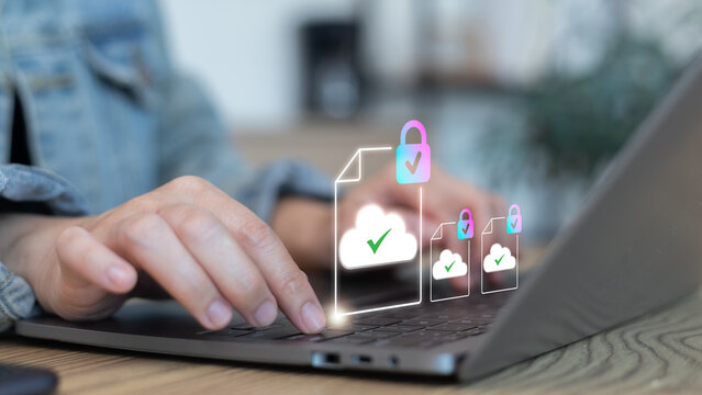 Woman's hands typing on a laptop with virtual cloud document icons and padlocks. Concept of secure file storage, data encryption, and safe cloud computing for business. - Powered by Adobe