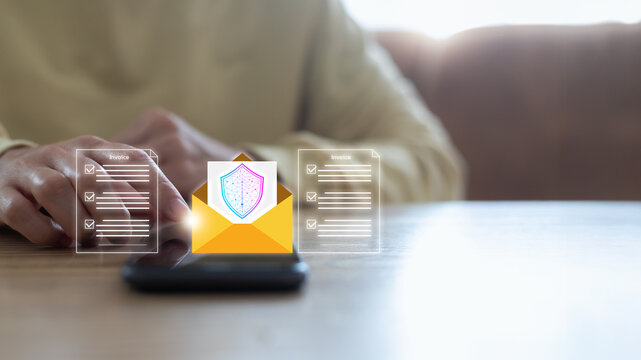 Hand using a smartphone with virtual invoice documents and a secure email envelope with a shield icon. Concept of electronic billing, safe online payment, and digital transaction protection.