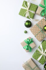 Beautiful Christmas composition with gifts and decor on white background, flat lay. Space for text