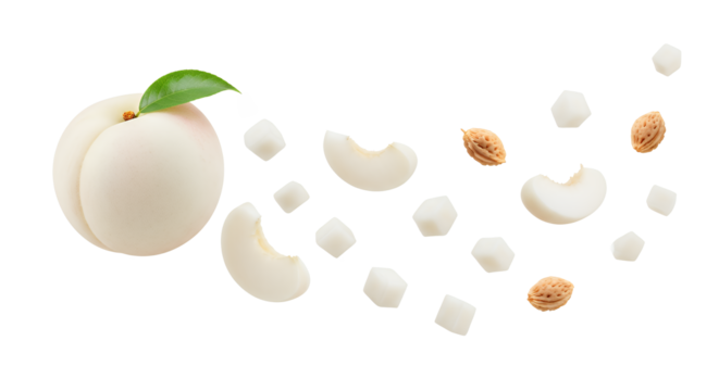 White peach slice with a seed core and sugar cubes on an isolated background