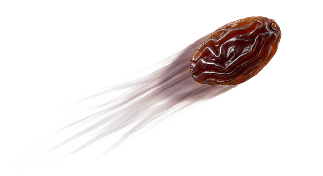 A single dried date fruit is captured in dynamic motion, creating a blur effect as it flies through the air, isolated on a clean white background