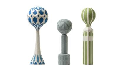 Three stylized, patterned decorative obelisk-like objects