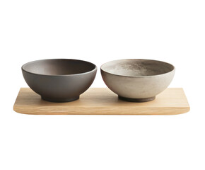 Two ceramic bowls on a light wood tray