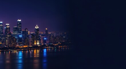 Obraz premium Nighttime urban landscape with illuminated skyline and water reflection
