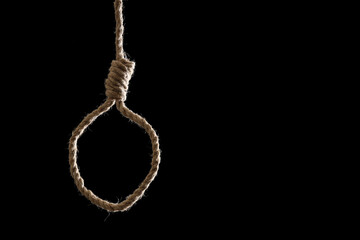 Hanging rope with loop on black background. Suicide concept
