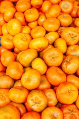 Fresh tangerines in full vertical view