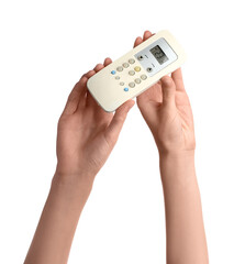 Female hands with air conditioner remote control isolated on white background