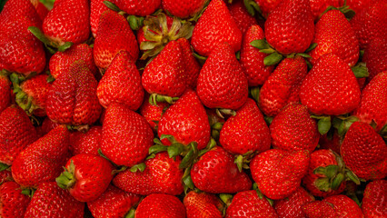 Fresh ripe strawberries close-up with detailed texture