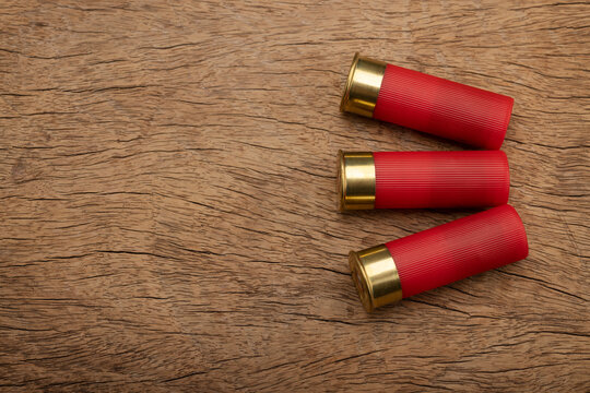 12 Gauge shotgun shells , Ammunition bullets of Shotgun on wooden background