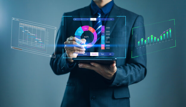 Businessman using digital tablet with virtual data analytics dashboard, futuristic charts, and graphs for business intelligence, data visualization, and financial performance analysis.